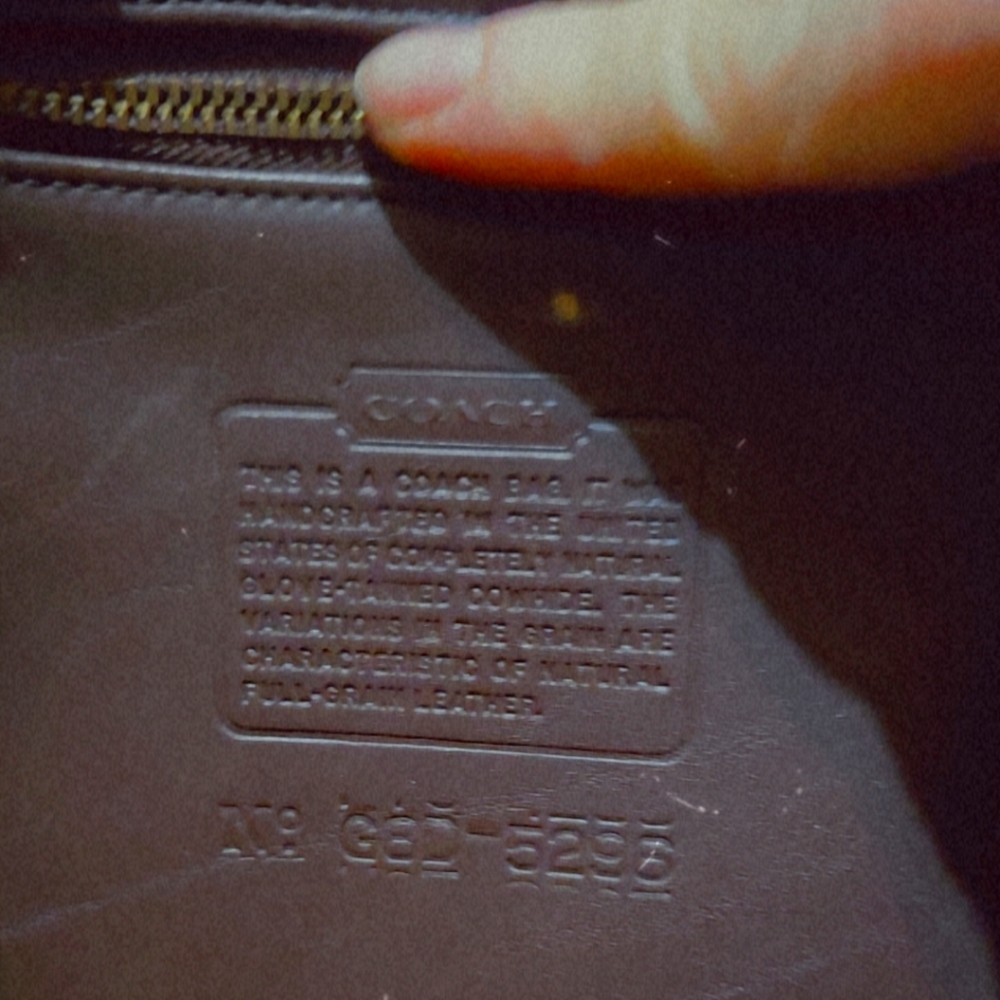 Coach Black Leather Wallet with Elegant Embossing